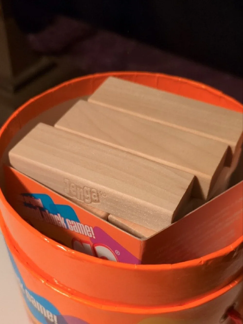 Hasbro Jenga Wooden Block Game - Orange Multicolor Tube- Tan Wooden Blocks